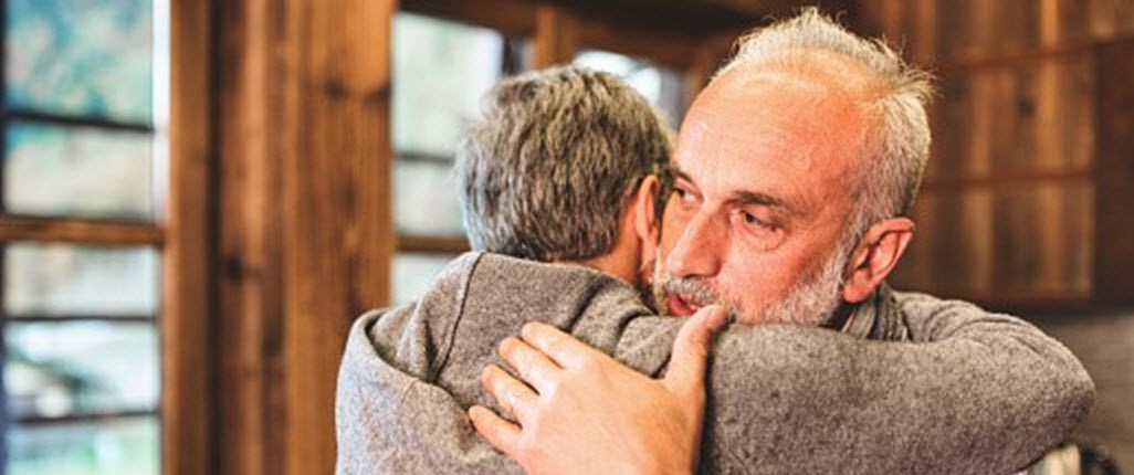 Son hugging father