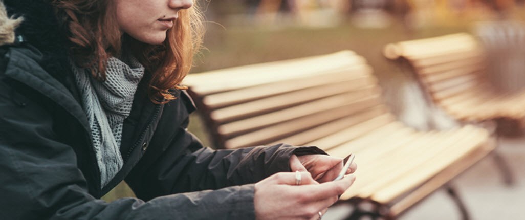 Girl sitting on the bench and waiting