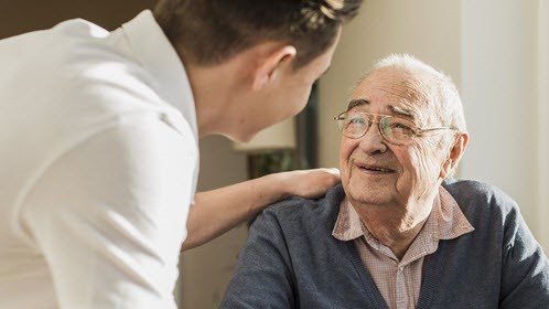 Caregiver with elderly man